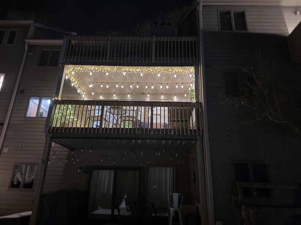 Three Ridges 405 private deck with string lights at night