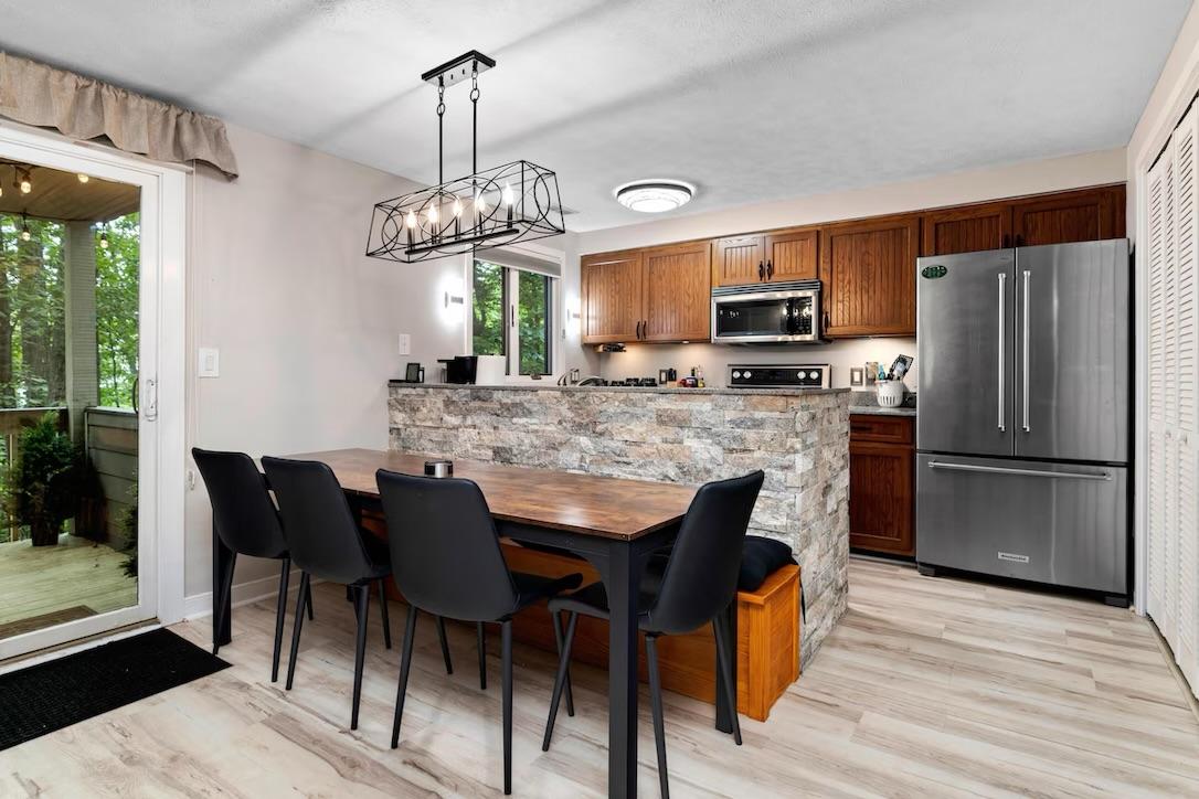Three Ridges 405 kitchen and dining area with stone island