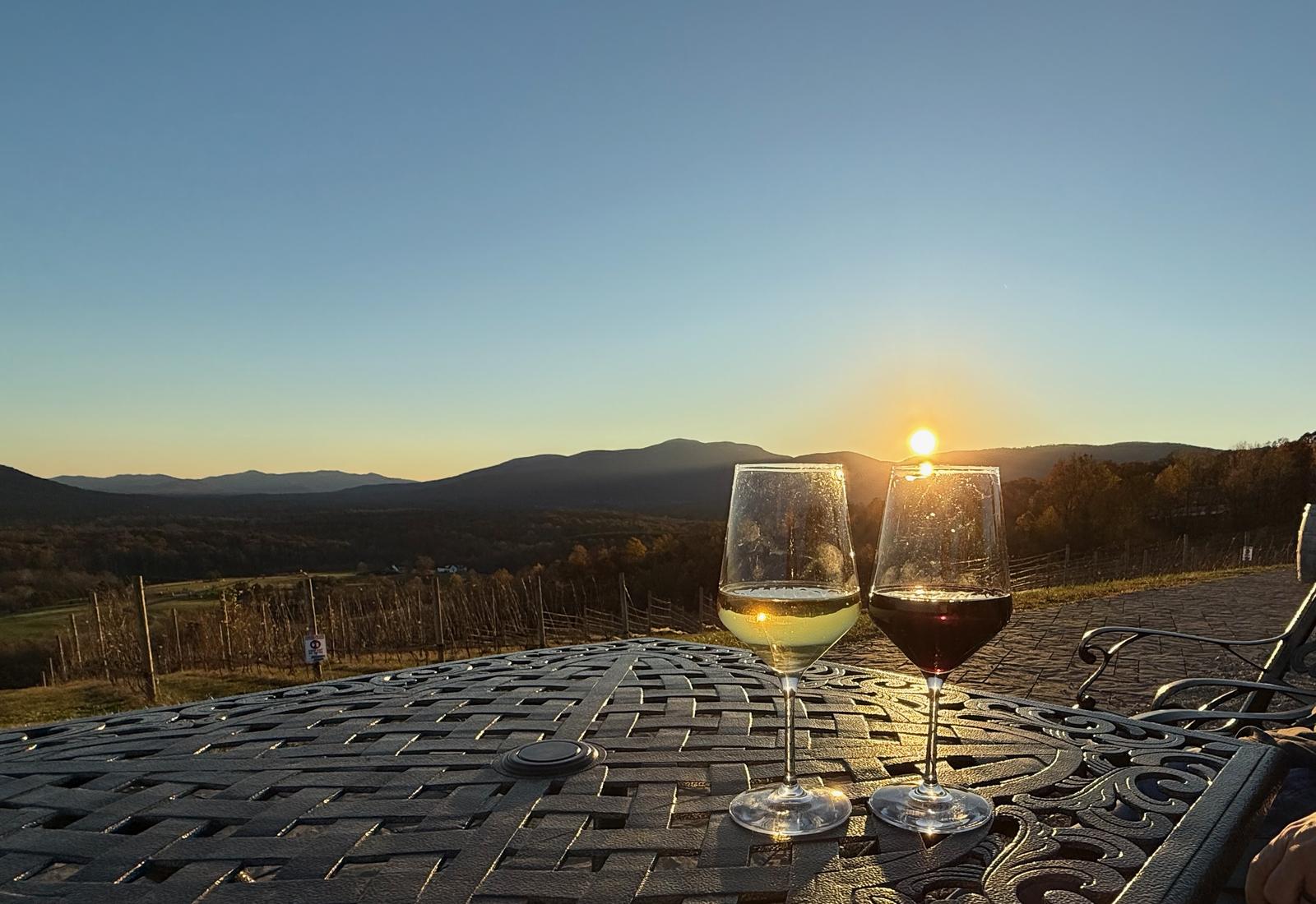 Vineyard sunset with wine glasses in Virginia Blue Ridge