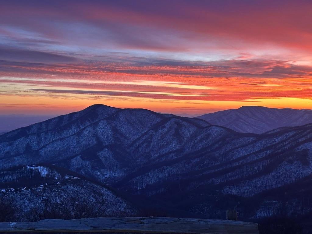 Dramatic winter sunrise over snowy Blue Ridge Mountains